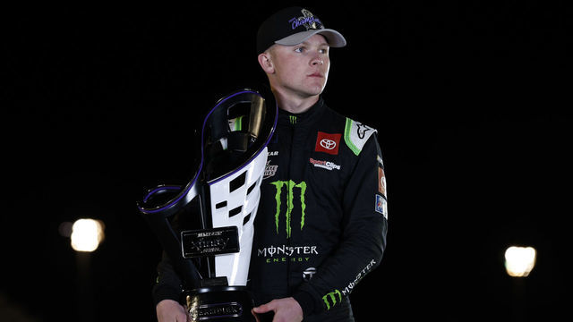 AVONDALE, ARIZONA - NOVEMBER 05: Ty Gibbs, driver of the #54 Monster Energy Toyota, poses with the 2022 NASCAR Xfinity Series Championship trophy after winning the NASCAR Xfinity Series Championship at Phoenix Raceway on November 05, 2022 in Avondale, Arizona.