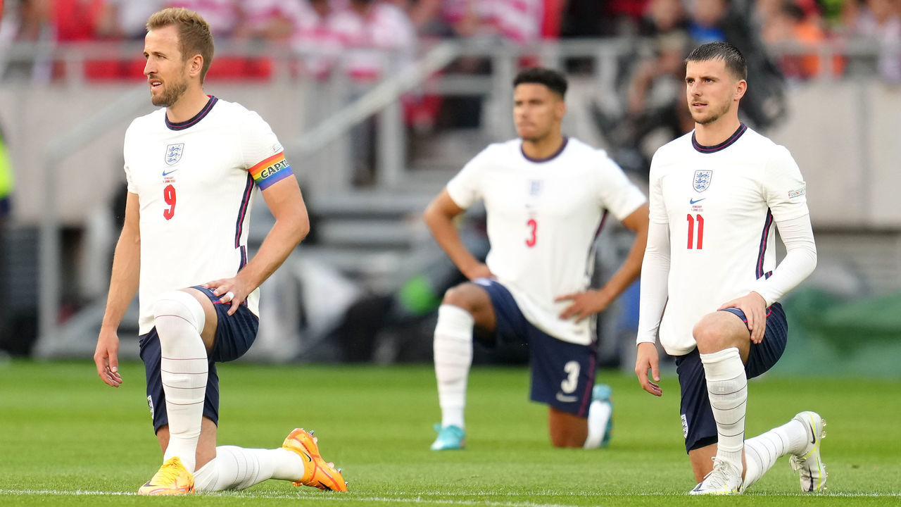 England's Harry Kane, James Justin and Mason Mount take a knee as Hungary's Adam Nagy (left) stands before the UEFA Nations League match at the Puskas Arena, Budapest. Picture date: Saturday June 4, 2022.