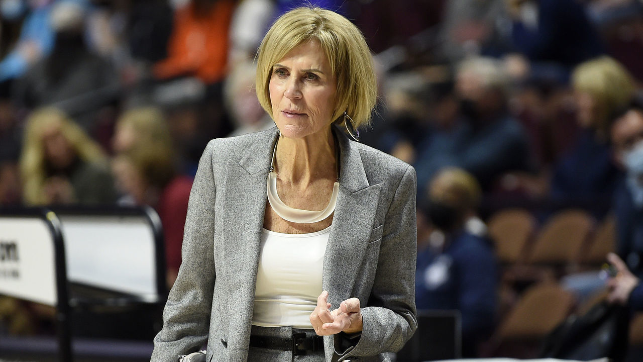 UNCASVILLE, CONNECTICUT - DECEMBER 19: Associate head coach Chris Dailey of the Connecticut Huskies watches the teams warm up before the game against the Louisville Cardinals in the Basketball Hall of Fame Women's Showcase at Mohegan Sun Arena on December 19, 2021 in Uncasville, Connecticut.