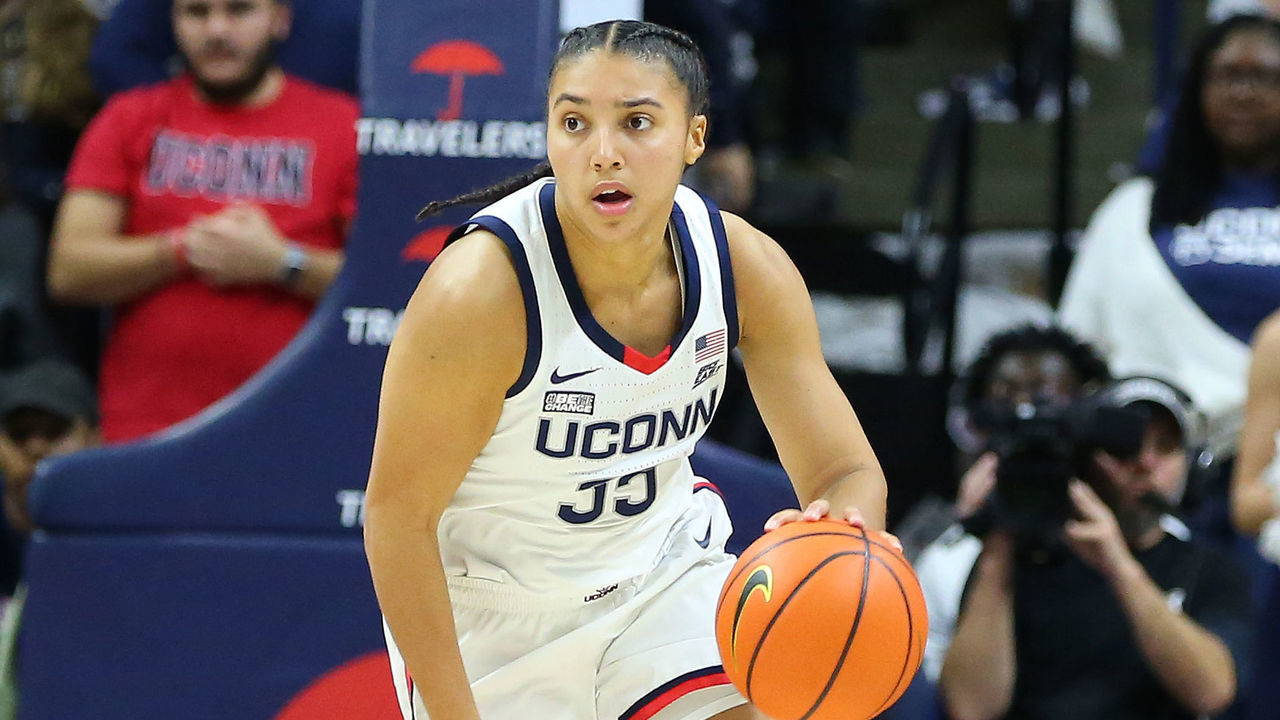 STORRS, CT - NOVEMBER 14: UConn Huskies guard Azzi Fudd (35) fast-breaks while pursued by Texas Longhorns guard Sonya Morris (11) during a women's college basketball game between Texas Longhorns and UConn Huskies on November 14, 2022, at Harry A. Gampel Pavilion in Storrs, CT.