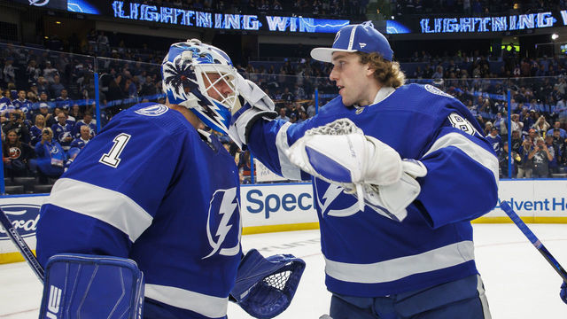 TAMPA, FL - OCTOBER 22: Goalies Brian Elliott #1 and Andrei Vasilevskiy #88 of the Tampa Bay Lightning celebrate the win against the New York Islanders at Amalie Arena on October 22, 2022 in Tampa, Florida.