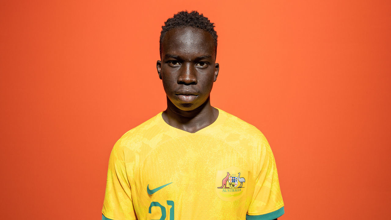 DOHA, QATAR - NOVEMBER 15: Garang Kuol of Australia poses during the official FIFA World Cup Qatar 2022 portrait session on November 15, 2022 in Doha, Qatar.
