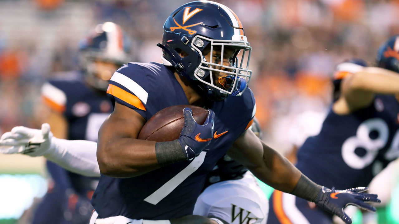 CHARLOTTESVILLE, VA - SEPTEMBER 24: Mike Hollins #7 of the Virginia Cavaliers returns a kickoff in the first half during against the Wake Forest Demon Deacons a game at Scott Stadium on September 24, 2021 in Charlottesville, Virginia.