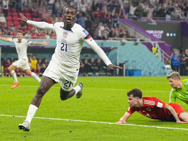 DOHA, QATAR - NOVEMBER 21: Timothy Weah of USA celebrates after scoring his team's first goal during the FIFA World Cup Qatar 2022 Group B match between USA and Wales at Ahmad Bin Ali Stadium on November 21, 2022 in Doha, Qatar.