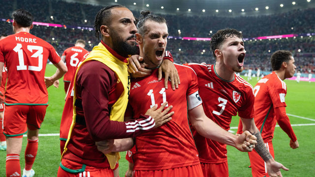 AL RAYYAN, QATAR - NOVEMBER 21: Sorba Thomas #22 of Wales, Christian Bale #11 of Wales, and Neco Williams #3 of Wales celebrates Bales' penalty-kick goal during a FIFA World Cup Qatar 2022 Group B match between Wales and USMNT at Ahmad Bin Ali Stadium on November 21, 2022 in Al Rayyan, Qatar.