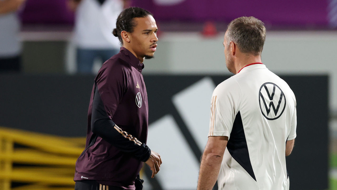 AL RUWAIS, QATAR - NOVEMBER 20: Leroy Sane of Germany speaks with Hansi Flick, Head Coach of Germany, during the Germany Training Session at Al Shamal Stadium on November 20, 2022 in Al Ruwais, Qatar.