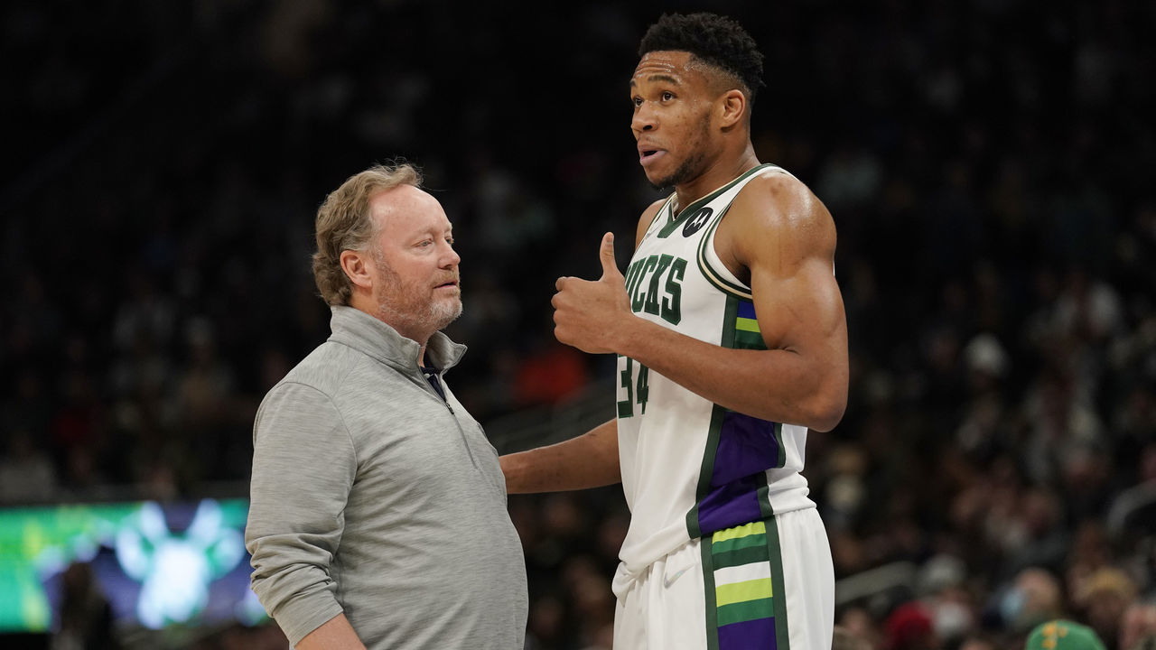 MILWAUKEE, WISCONSIN - NOVEMBER 24: Giannis Antetokounmpo #34 of the Milwaukee Bucks talks with head coach Mike Budenholzer after a play against the Detroit Pistons in the first half at Fiserv Forum on November 24, 2021 in Milwaukee, Wisconsin.