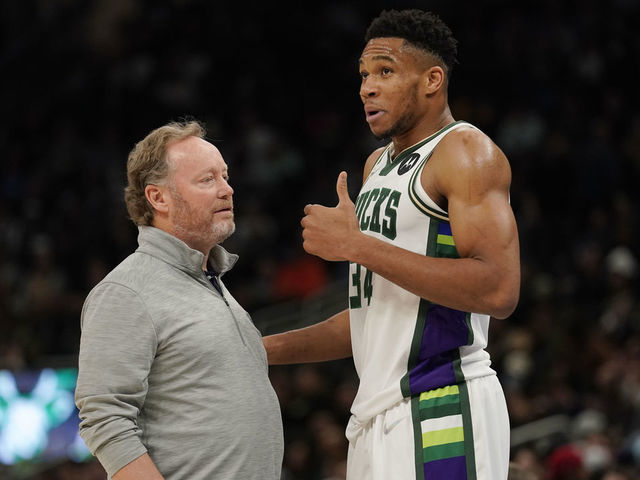 MILWAUKEE, WISCONSIN - NOVEMBER 24: Giannis Antetokounmpo #34 of the Milwaukee Bucks talks with head coach Mike Budenholzer after a play against the Detroit Pistons in the first half at Fiserv Forum on November 24, 2021 in Milwaukee, Wisconsin.