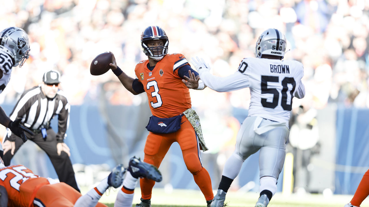 DENVER, COLORADO - NOVEMBER 20: Russell Wilson #3 of the Denver Broncos passes against Jayon Brown #50 of the Las Vegas Raiders during an NFL game between the Las Vegas Raiders and Denver Broncos at Empower Field At Mile High on November 20, 2022 in Denver, Colorado. The Las Vegas Raiders won in overtime