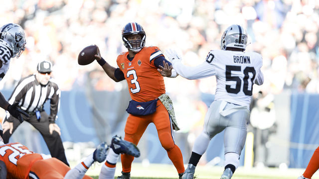 DENVER, COLORADO - NOVEMBER 20: Russell Wilson #3 of the Denver Broncos passes against Jayon Brown #50 of the Las Vegas Raiders during an NFL game between the Las Vegas Raiders and Denver Broncos at Empower Field At Mile High on November 20, 2022 in Denver, Colorado. The Las Vegas Raiders won in overtime