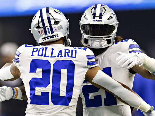 ARLINGTON, TEXAS - OCTOBER 2: Tony Pollard #20 and Ezekiel Elliott #21 of the Dallas Cowboys hug before a game against the Washington Commanders at AT&T Stadium on October 2, 2022 in Arlington, Texas. The Cowboys defeated the Commanders 25-10.