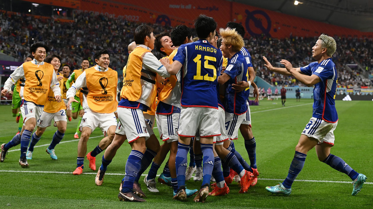 DOHA, QATAR - NOVEMBER 23: Ritsu Doan of Japan celebrates with teammates after scoring their team's first goal during the FIFA World Cup Qatar 2022 Group E match between Germany and Japan at Khalifa International Stadium on November 23, 2022 in Doha, Qatar.