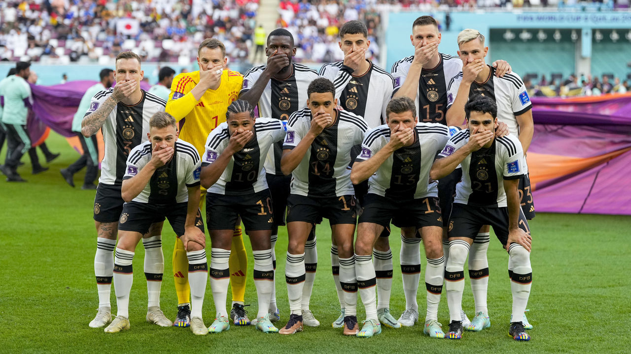 DOHA, QATAR - NOVEMBER 23: . German national team with hands in front of their mouths in protest prior to the FIFA World Cup Qatar 2022 Group E match between Germany and Japan at Khalifa International Stadium on November 23, 2022 in Doha, Qatar.