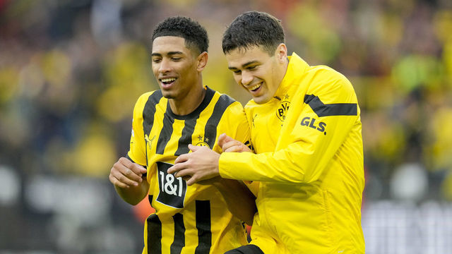 DORTMUND, GERMANY - OCTOBER 22: Jude Bellingham of Borussia Dortmund and Gio Reyna of Borussia Dortmund celebrate after winning after the Bundesliga match between Borussia Dortmund and VfB Stuttgart at Signal Iduna Park on October 22, 2022 in Dortmund, Germany.