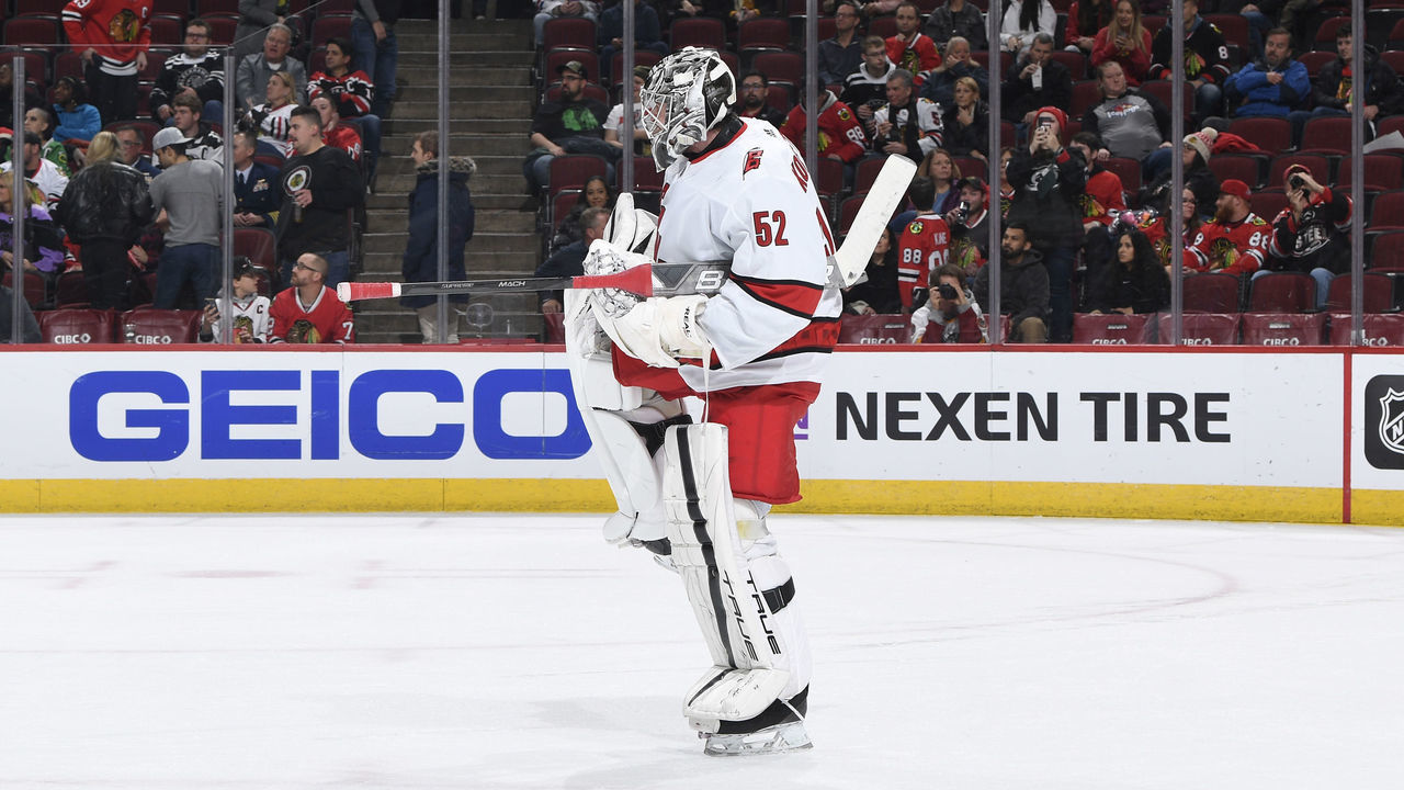CHICAGO, ILLINOIS - NOVEMBER 14: Goalie Pyotr Kochetkov #52 of the Carolina Hurricanes celebrates after making 27 saves for his first career shutout. The Carolina Hurricanes beat the Chicago Blackhawks 3-0 at United Center on November 14, 2022 in Chicago, Illinois.