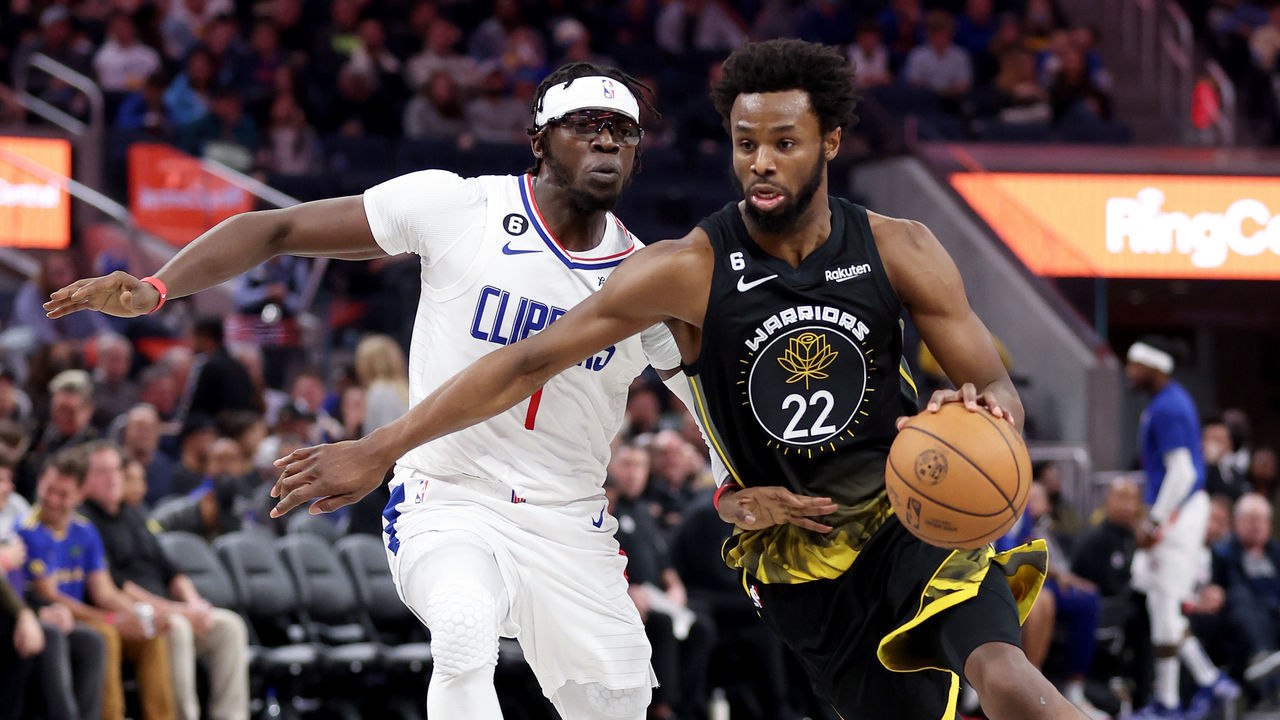 SAN FRANCISCO, CALIFORNIA - NOVEMBER 23: Andrew Wiggins #22 of the Golden State Warriors is guarded by Reggie Jackson #1 of the LA Clippers at Chase Center on November 23, 2022 in San Francisco, California.