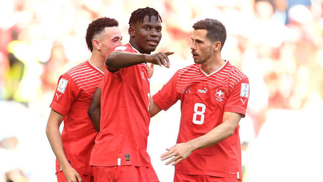 AL WAKRAH, QATAR - NOVEMBER 24: Breel Embolo (C) of Switzerland celebrates scoring their first goal with their teammates Ruben Vargas (L) and Remo Freuler (R) during the FIFA World Cup Qatar 2022 Group G match between Switzerland and Cameroon at Al Janoub Stadium on November 24, 2022 in Al Wakrah, Qatar.