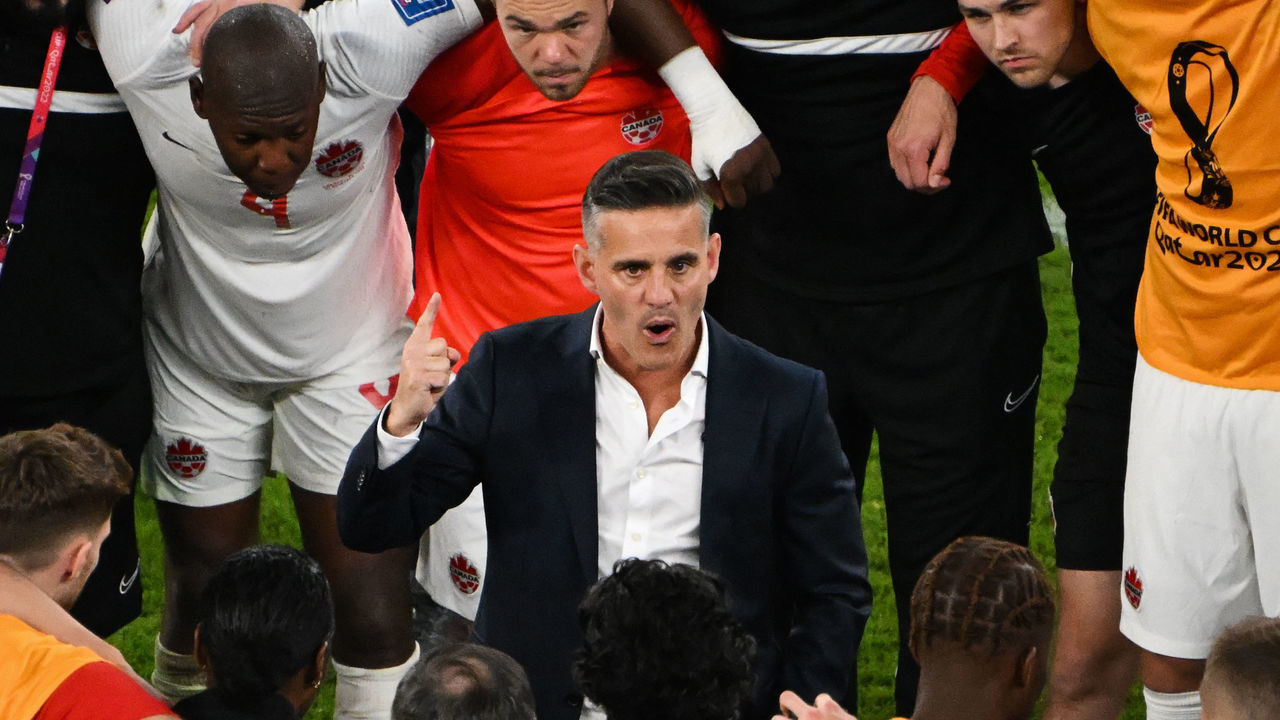 Canada's English coach John Herdman speaks to his players after the Qatar 2022 World Cup Group F football match between Belgium and Canada at the Ahmad Bin Ali Stadium in Al-Rayyan, west of Doha on November 23, 2022.