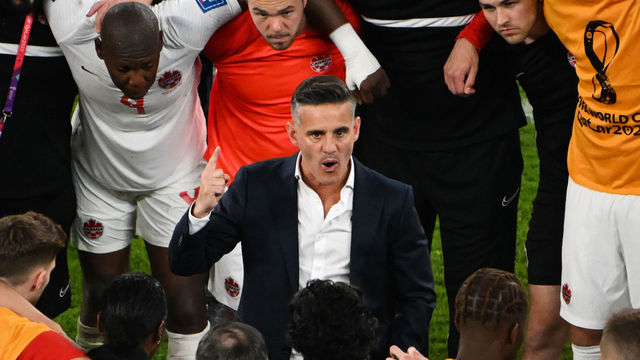 Canada's English coach John Herdman speaks to his players after the Qatar 2022 World Cup Group F football match between Belgium and Canada at the Ahmad Bin Ali Stadium in Al-Rayyan, west of Doha on November 23, 2022.