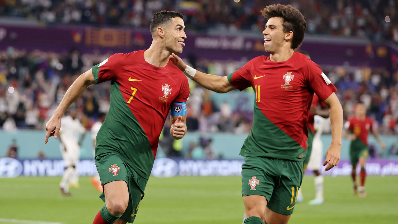 DOHA, QATAR - NOVEMBER 24: Cristiano Ronaldo of Portugal celebrates with Joao Felix after scoring their team's first goal via a penalty during the FIFA World Cup Qatar 2022 Group H match between Portugal and Ghana at Stadium 974 on November 24, 2022 in Doha, Qatar.
