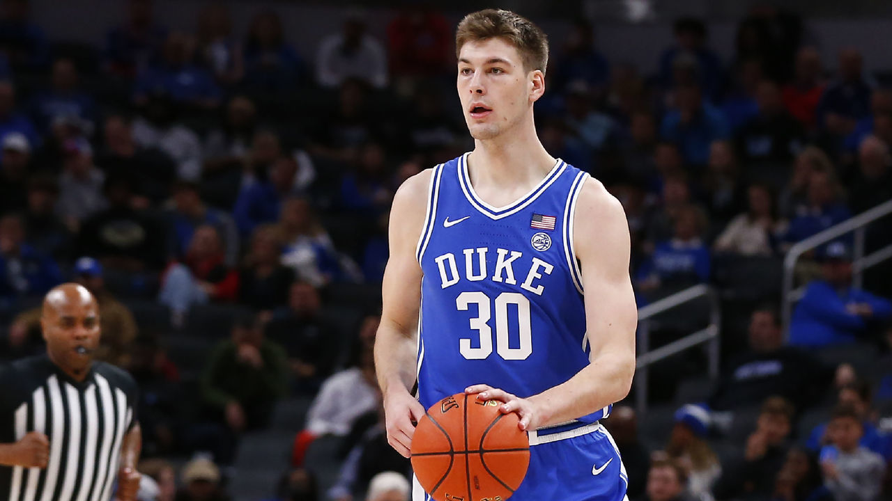 INDIANAPOLIS, IN - NOVEMBER 15: Duke Blue Devils center Kyle Filipowski (30) brings the ball up court during the men's Champions Classic college basketball game between the Duke Blue Devils and Kansas Jayhawks on November 15, 2022, at Gainbridge Fieldhouse in Indianapolis, IN.