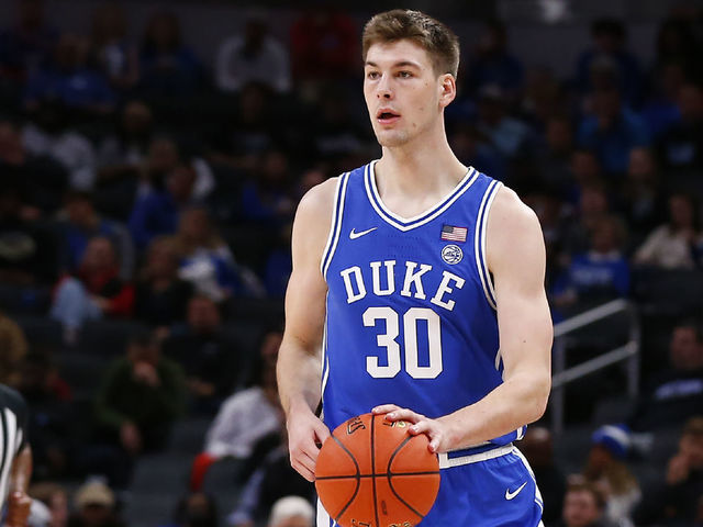 INDIANAPOLIS, IN - NOVEMBER 15: Duke Blue Devils center Kyle Filipowski (30) brings the ball up court during the men's Champions Classic college basketball game between the Duke Blue Devils and Kansas Jayhawks on November 15, 2022, at Gainbridge Fieldhouse in Indianapolis, IN.
