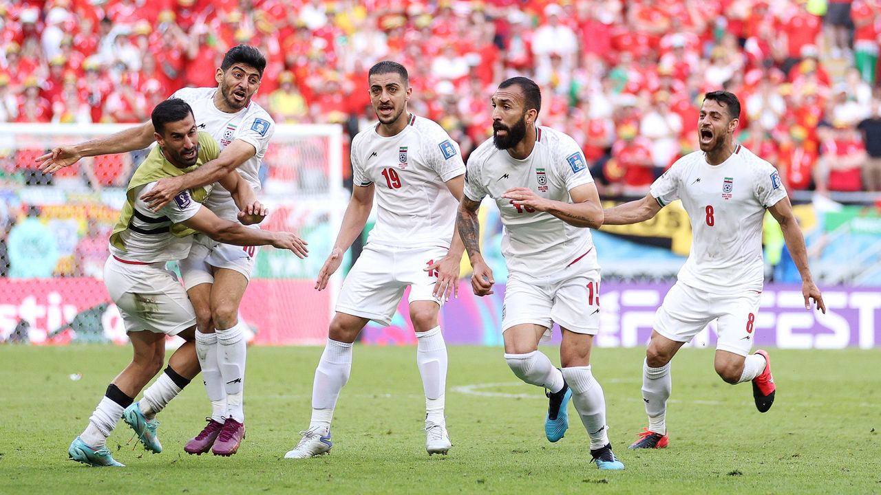DOHA, QATAR - NOVEMBER 25: Roozbeh Cheshmi of IR Iran celebrates with teammates after scoring their team's first goal during the FIFA World Cup Qatar 2022 Group B match between Wales and IR Iran at Ahmad Bin Ali Stadium on November 25, 2022 in Doha, Qatar.