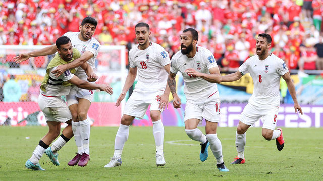 DOHA, QATAR - NOVEMBER 25: Roozbeh Cheshmi of IR Iran celebrates with teammates after scoring their team's first goal during the FIFA World Cup Qatar 2022 Group B match between Wales and IR Iran at Ahmad Bin Ali Stadium on November 25, 2022 in Doha, Qatar.
