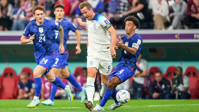 AL KHOR, QATAR - NOVEMBER 25: Harry Kane of England and Tyler Adams of USA battle for the ball during the FIFA World Cup Qatar 2022 Group B match between England and USA at Al Bayt Stadium on November 25, 2022 in Al Khor, Qatar.