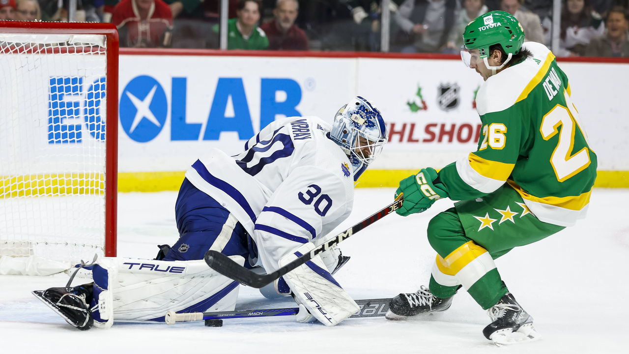 ST PAUL, MN - NOVEMBER 25: Matt Murray #30 of the Toronto Maple Leafs makes a save against Connor Dewar #26 of the Minnesota Wild in the second period of the game at Xcel Energy Center on November 25, 2022 in St Paul, Minnesota.