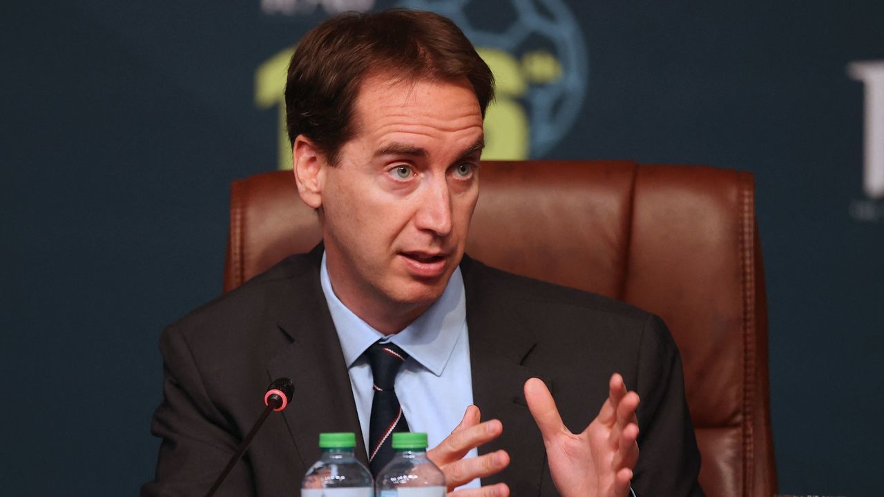 English Football Association CEO Mark Bullingham speaks during the 137th International Football Association Board (IFAB) meeting in the Qatari capital Doha on June 13, 2022. - Football's rules body today said that five substitutes would be permanently introduced for all top games and that an automatic offside detector is closer to being introduced for this year's World Cup.