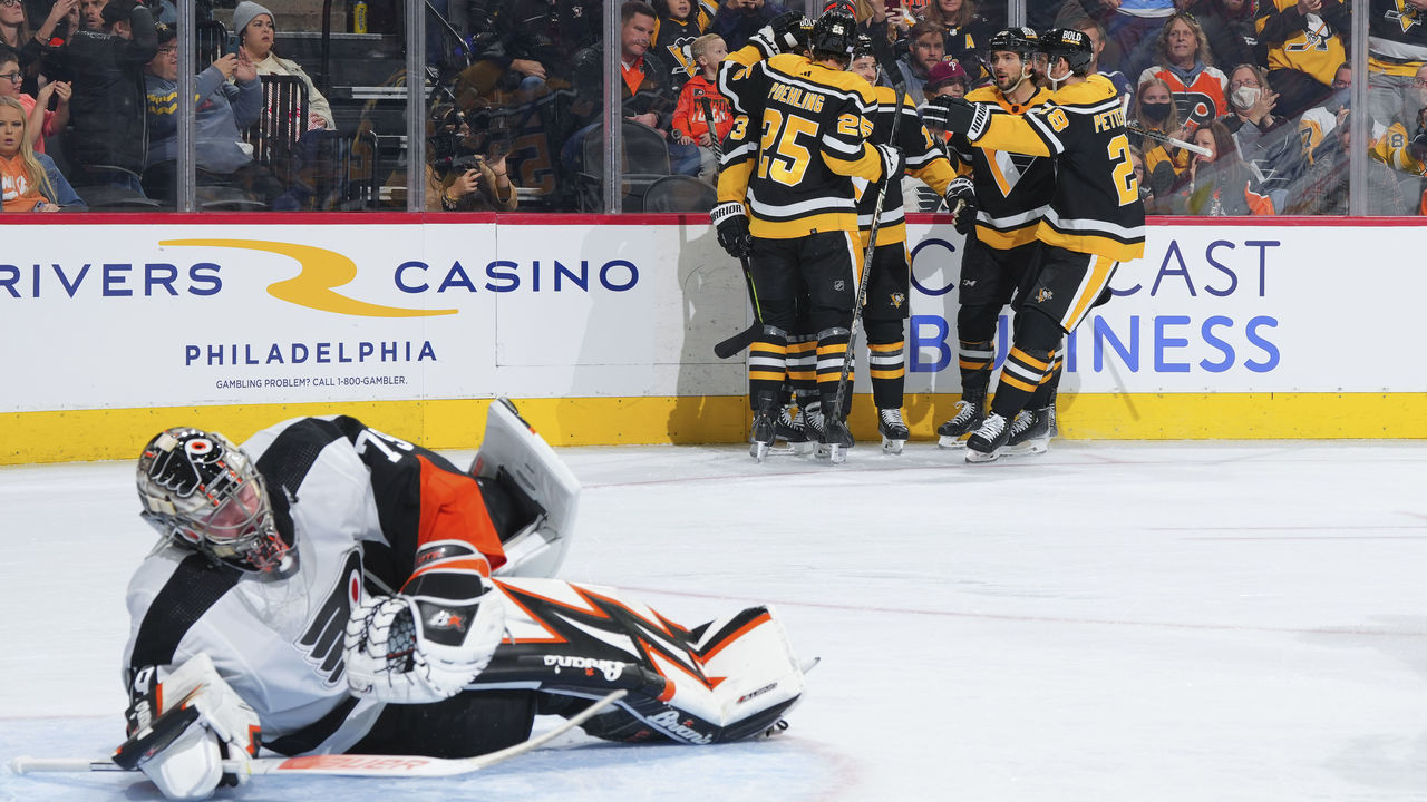 PHILADELPHIA, PA - NOVEMBER 25: Josh Archibald #15 of the Pittsburgh Penguins celebrates with Ryan Poehling #25, Kris Letang #58, and Marcus Pettersson #28 after scoring a goal against Carter Hart #79 of the Philadelphia Flyers in the first period at the Wells Fargo Center on November 25, 2022 in Philadelphia, Pennsylvania.