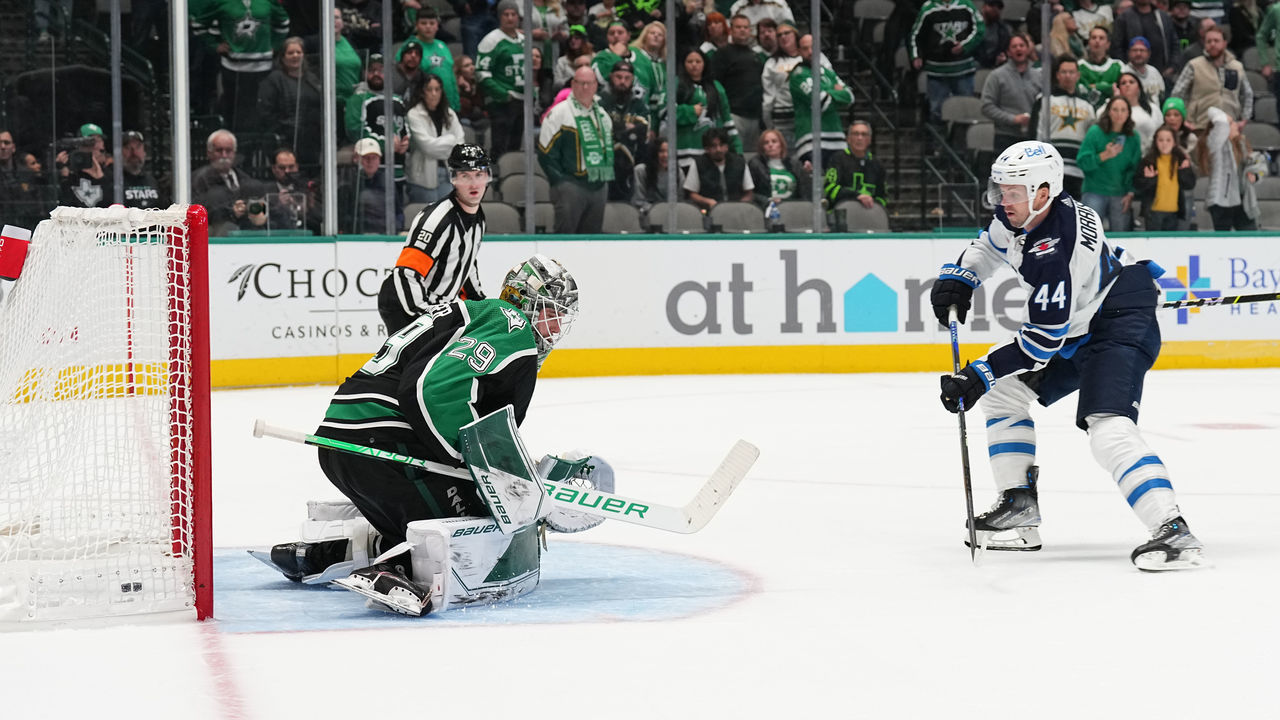 DALLAS, TX - NOVEMBER 25: Josh Morrissey #44 of the Winnipeg Jets scores the game-winning goal against the Jake Oettinger #29 of the Dallas Stars at the American Airlines Center on November 25, 2022 in Dallas, Texas.