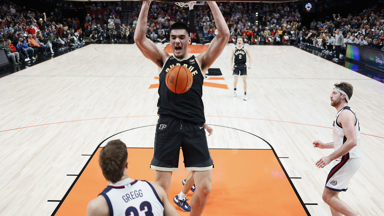 PORTLAND, OREGON - NOVEMBER 25: Zach Edey #15 of the Purdue Boilermakers dunks the ball as Ben Gregg #33 of the Gonzaga Bulldogs looks on during the second half at Moda Center on November 25, 2022 in Portland, Oregon.