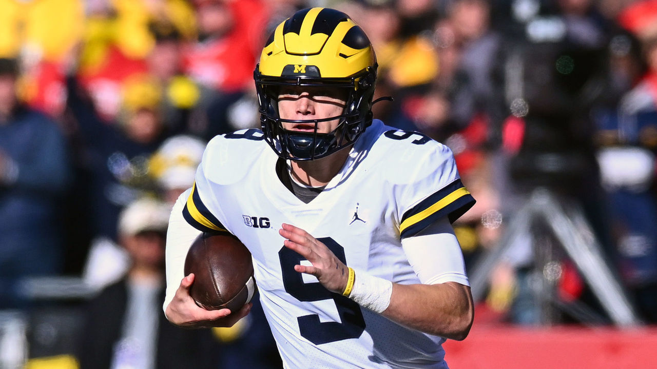 COLUMBUS, OHIO - NOVEMBER 26: J.J. McCarthy #9 of the Michigan Wolverines runs with the ball during the second quarter of a game against the Ohio State Buckeyes at Ohio Stadium on November 26, 2022 in Columbus, Ohio.