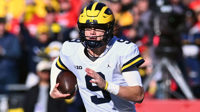 COLUMBUS, OHIO - NOVEMBER 26: J.J. McCarthy #9 of the Michigan Wolverines runs with the ball during the second quarter of a game against the Ohio State Buckeyes at Ohio Stadium on November 26, 2022 in Columbus, Ohio.