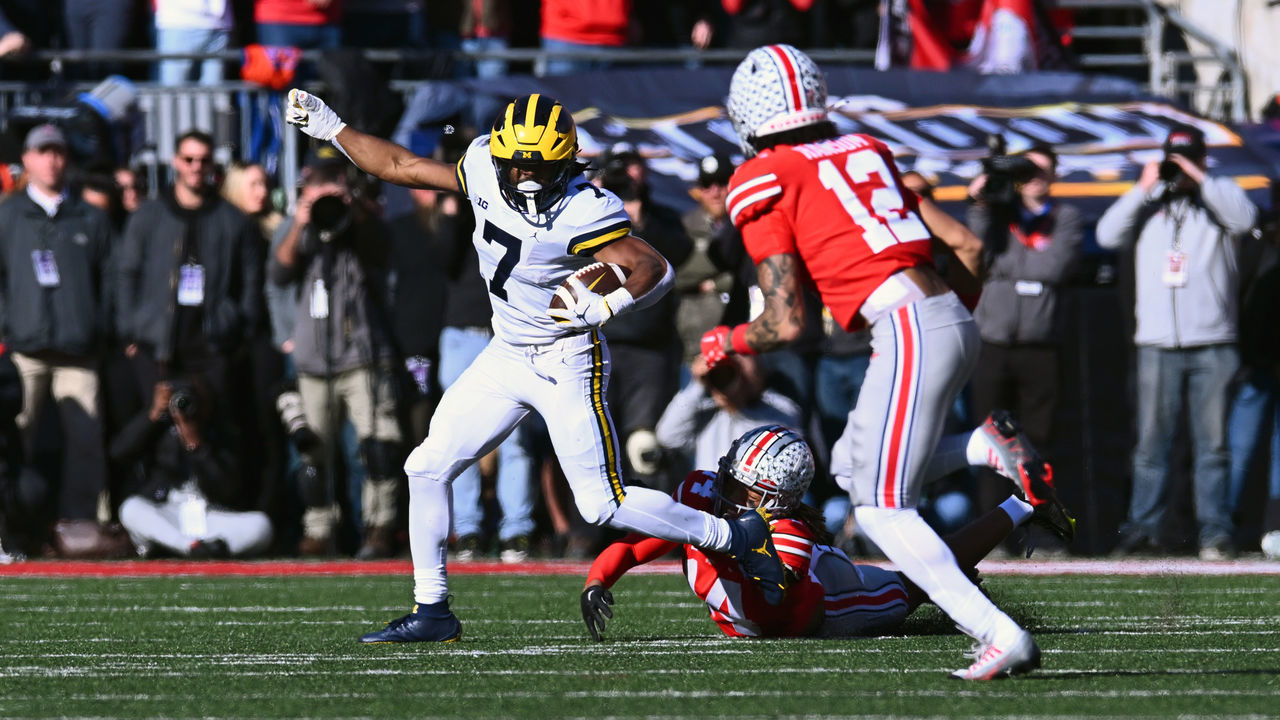 COLUMBUS, OHIO - NOVEMBER 26: Donovan Edwards #7 of the Michigan Wolverines evades a tackle during the second quarter of a game against the Ohio State Buckeyes at Ohio Stadium on November 26, 2022 in Columbus, Ohio.