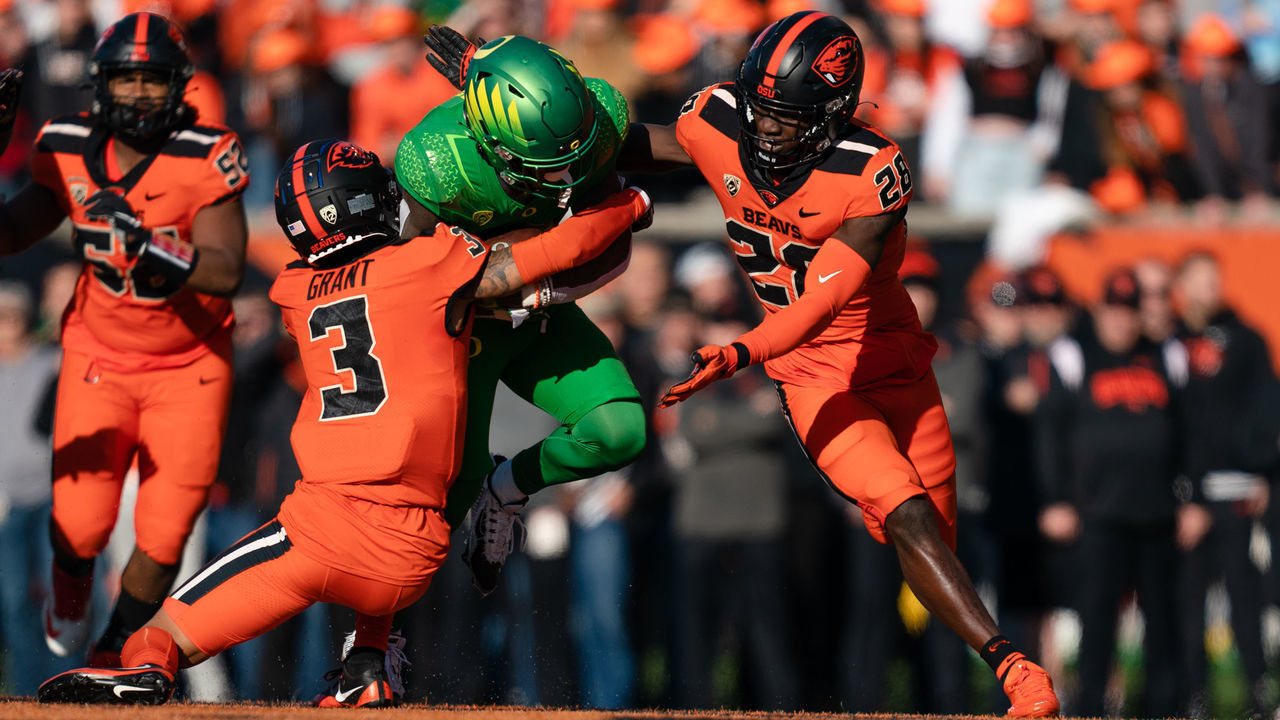 CORVALLIS, OR - NOVEMBER 26: Defensive back Jaydon Grant #3 of the Oregon State Beavers makes a tackle during the first half of the game against the Oregon Ducks at Reser Stadium on November 26, 2022 in Corvallis, Oregon.