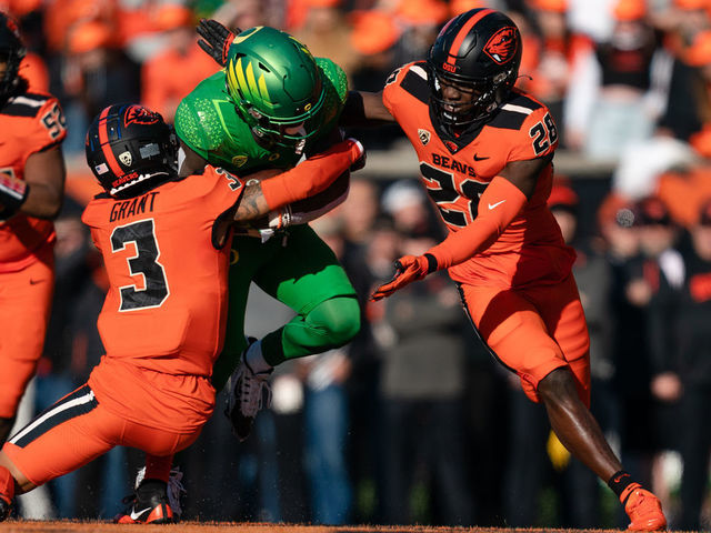 CORVALLIS, OR - NOVEMBER 26: Defensive back Jaydon Grant #3 of the Oregon State Beavers makes a tackle during the first half of the game against the Oregon Ducks at Reser Stadium on November 26, 2022 in Corvallis, Oregon.