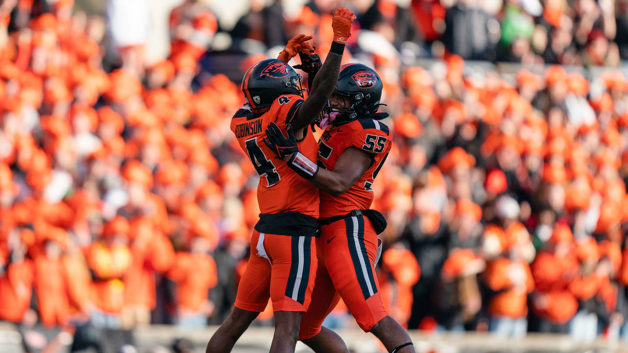 CORVALLIS, OR - NOVEMBER 26: Defensive back Jaden Robinson #4 and linebacker Easton Mascarenas-Arnold #55 of the Oregon State Beavers celebrate during the first half of the game against the Oregon Ducks at Reser Stadium on November 26, 2022 in Corvallis, Oregon.