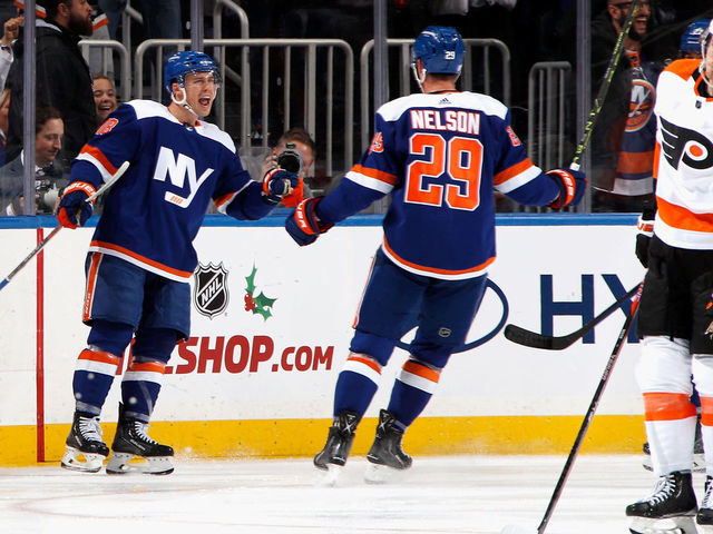 ELMONT, NEW YORK - NOVEMBER 26: Anthony Beauvillier #18 of the New York Islanders scores a third period goal against the Philadelphia Flyers and is joined by Brock Nelson #29 at the UBS Arena on November 26, 2022 in Elmont, New York.