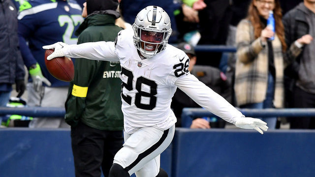 SEATTLE, WASHINGTON - NOVEMBER 27: Josh Jacobs #28 of the Las Vegas Raiders celebrates a touchdown during the first half in the game against the Seattle Seahawks at Lumen Field on November 27, 2022 in Seattle, Washington.