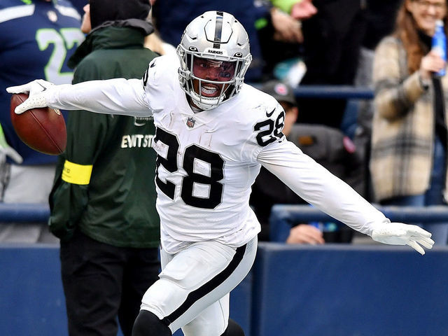 SEATTLE, WASHINGTON - NOVEMBER 27: Josh Jacobs #28 of the Las Vegas Raiders celebrates a touchdown during the first half in the game against the Seattle Seahawks at Lumen Field on November 27, 2022 in Seattle, Washington.