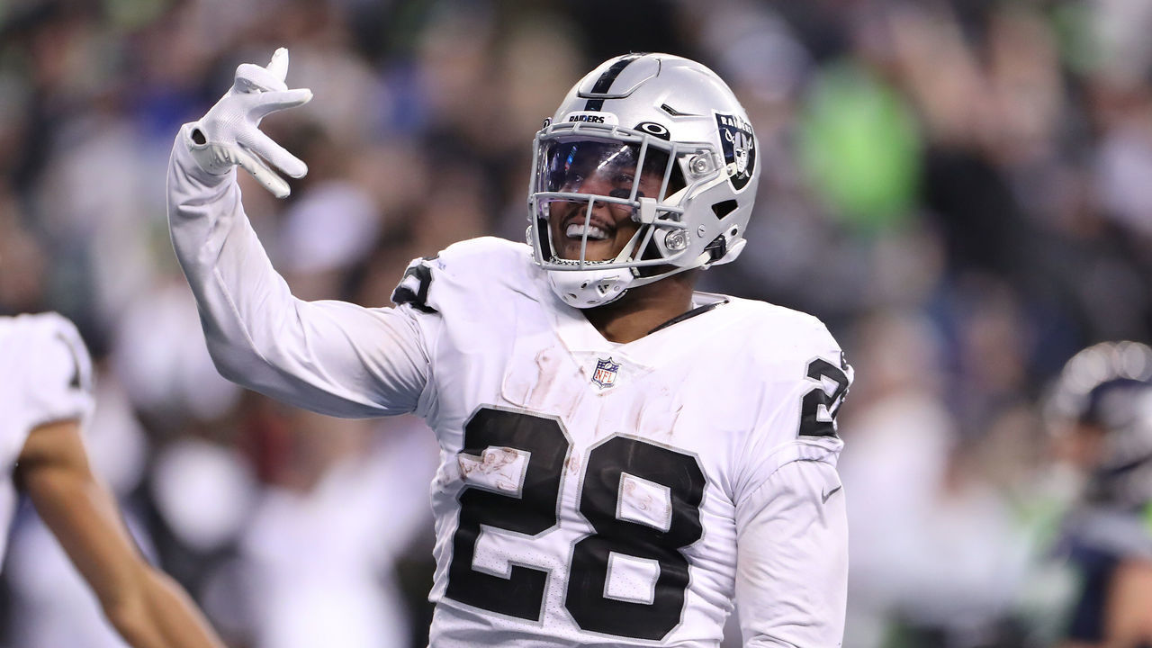 SEATTLE, WASHINGTON - NOVEMBER 27: Josh Jacobs #28 of the Las Vegas Raiders celebrates after scoring a touchdown in overtime to beat the Seattle Seahawks 40-34 at Lumen Field on November 27, 2022 in Seattle, Washington.