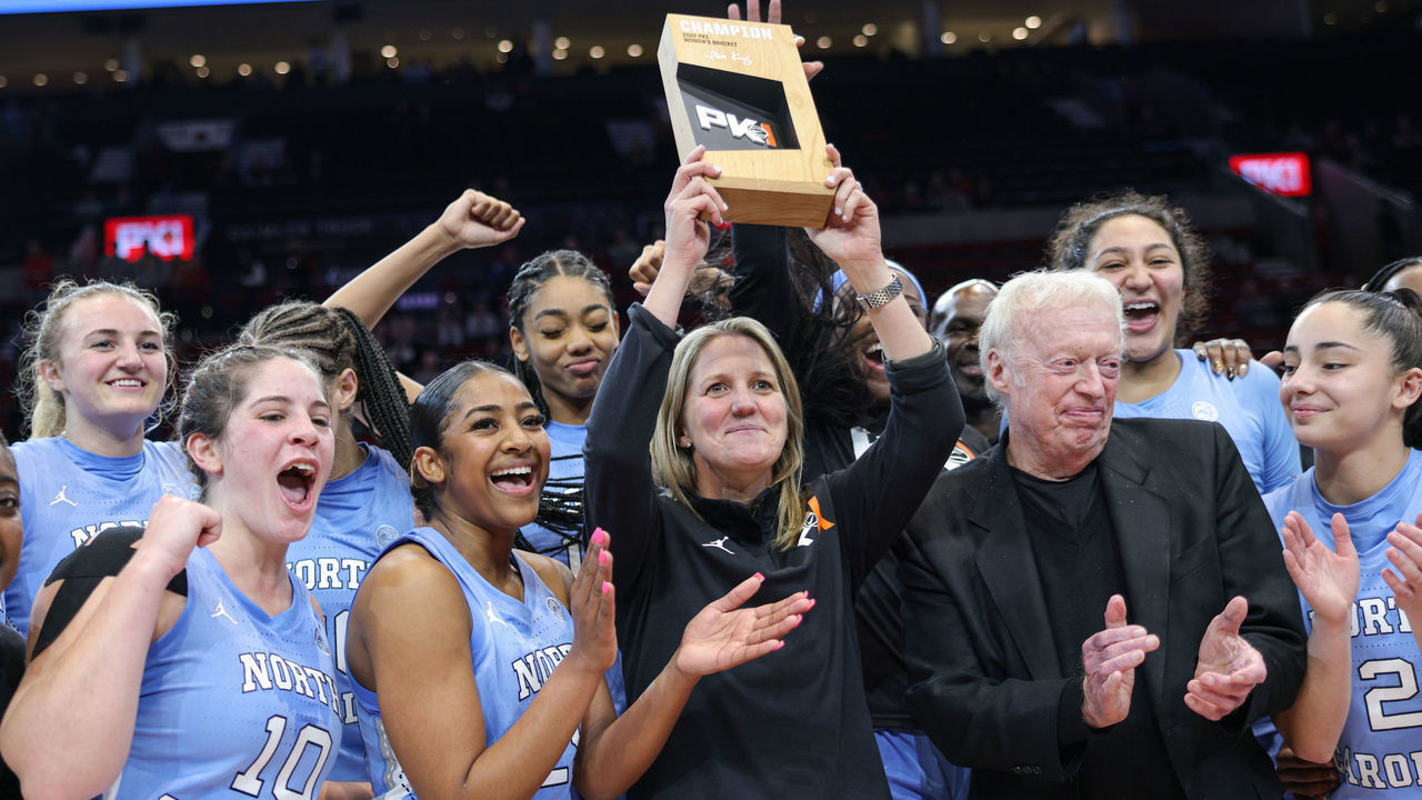 PORTLAND, OR - NOVEMBER 27: Head coach Courtney Banghart of the North Carolina Tar Heels holds the trophy following the game against the Iowa State Cyclones in the Phil Knight Invitational Tournament Women's Championship at Moda Center on November 27, 2022 in Portland, Oregon.