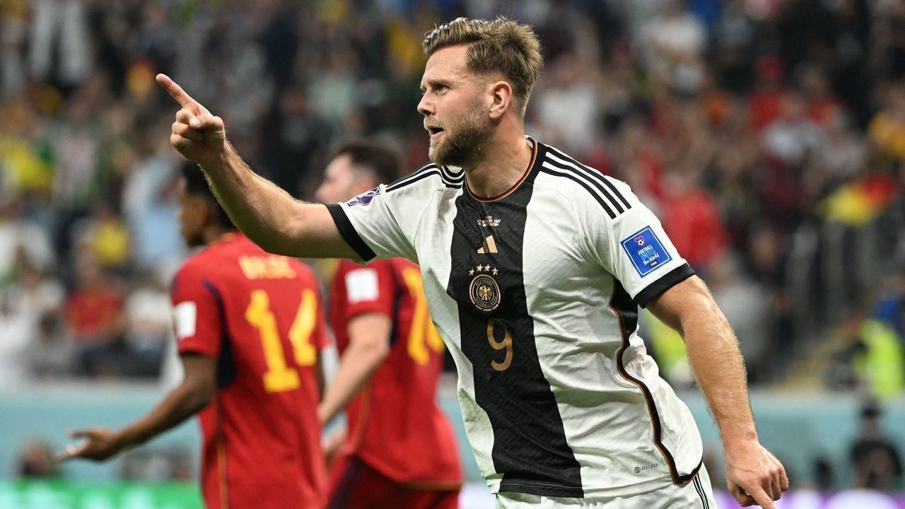 Germany's forward #09 Niclas Fullkrug celebrates scoring his team's first goal during the Qatar 2022 World Cup Group E football match between Spain and Germany at the Al-Bayt Stadium in Al Khor, north of Doha on November 27, 2022.