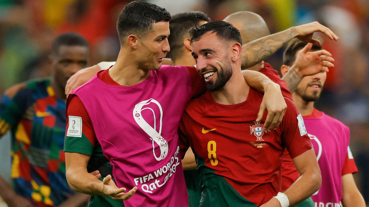 Portugal's forward #07 Cristiano Ronaldo (L) and Portugal's midfielder #08 Bruno Fernandes celebrate after they won the Qatar 2022 World Cup Group H football match between Portugal and Uruguay at the Lusail Stadium in Lusail, north of Doha on November 28, 2022.