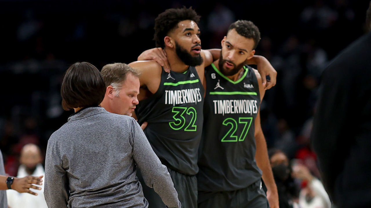 WASHINGTON, DC - NOVEMBER 28: Karl-Anthony Towns #32 of the Minnesota Timberwolves is helped off the court by teammate Rudy Gobert #27 after being injured in the third quarter against the Washington Wizards at Capital One Arena on November 28, 2022 in Washington, DC.