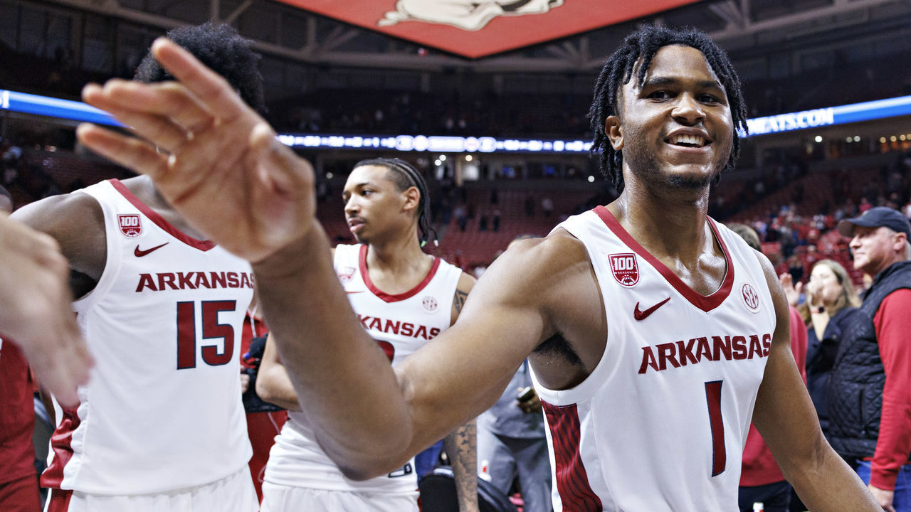 FAYETTEVILLE, ARKANSAS - NOVEMBER 28: Ricky Council IV #1 of the Arkansas Razorbacks greets fans after a game against the Troy Trojans at Bud Walton Arena on November 28, 2022 in Fayetteville, Arkansas. The Razorbacks defeated the Trojans 74-61.