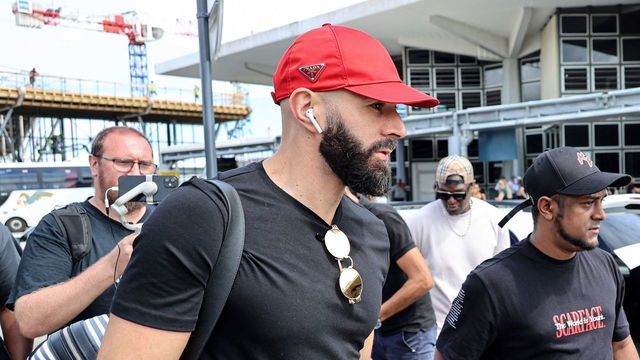 French footballer Karim Benzema (C) arrives at La Reunion's Roland-Garros airport in Sainte-Marie on November 29, 2022. - Ballon D'Or winner Karim Benzema has been ruled out of the World Cup with a left thigh injury on November 19, 2022 dealing a serious blow to defending champions France's hopes of retaining the trophy.
